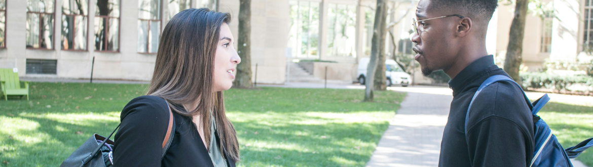 Young woman and young man talking on a sunny day 