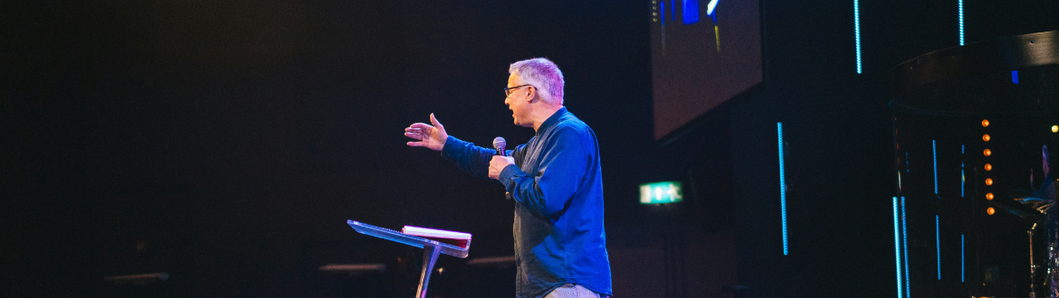 Man speaking to an unseen audience