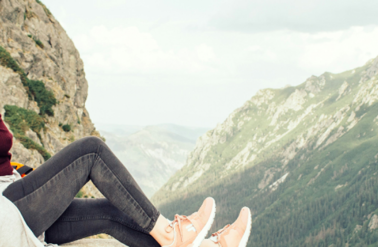 woman sitting on a rock