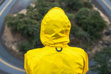 Person in yellow waterproof coat