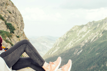 woman sitting on a rock