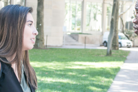 Young woman and young man talking on a sunny day 